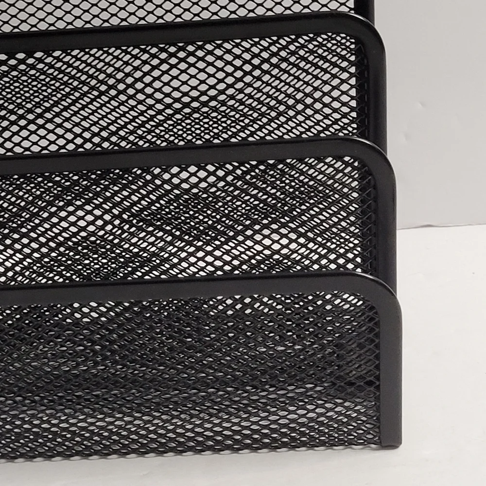 Black, three-tiered metal mesh file holder. 318